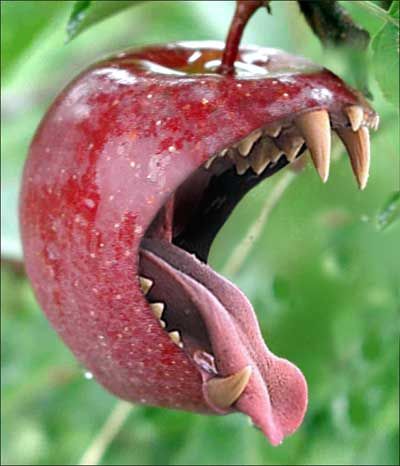 an apple with its mouth open and teeth wide open