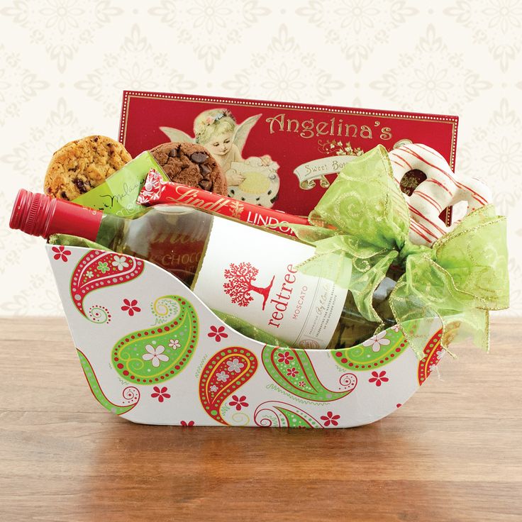 a gift basket with wine, cookies and candies for someone's special occasion