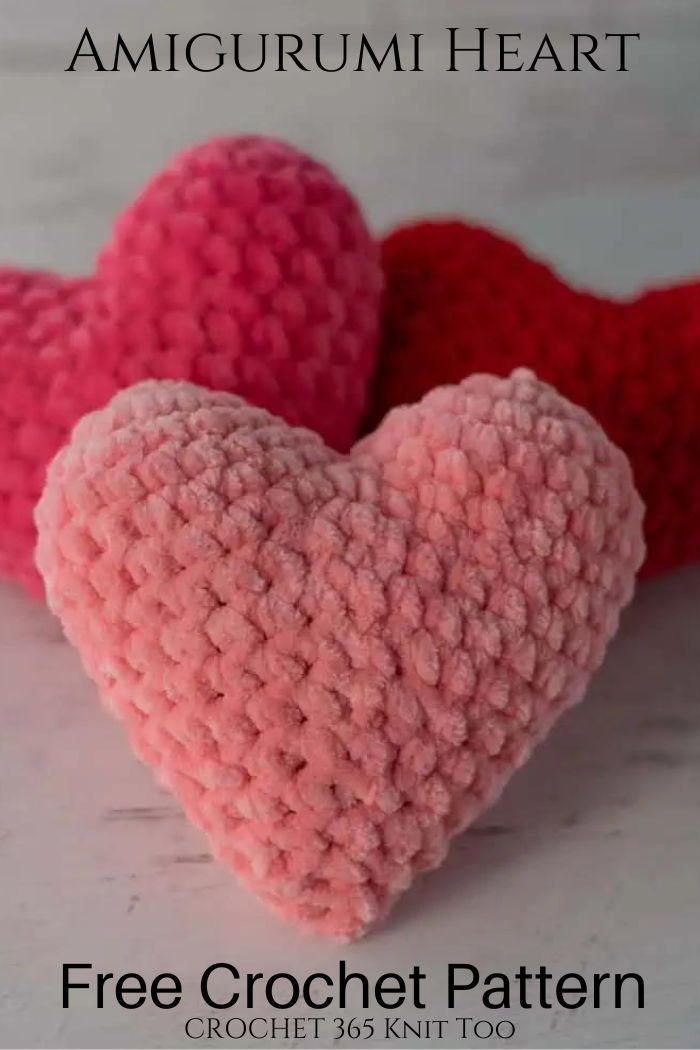 two crocheted hearts sitting next to each other