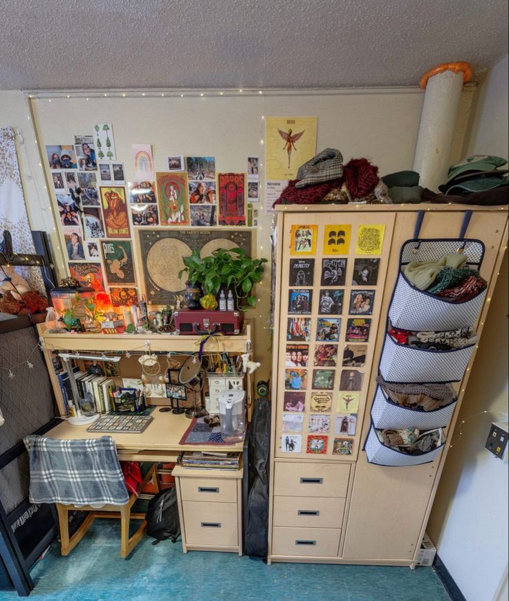 a room filled with lots of clutter next to a blue rug and wooden cabinets