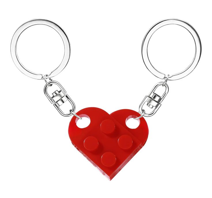 a lego heart keychain with two holes in the middle and one hole at the bottom