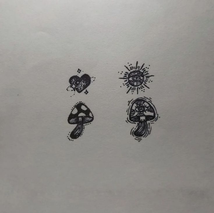 two black and white ink drawings of mushrooms