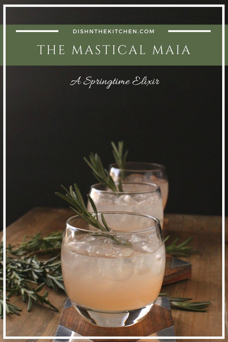 three glasses filled with lemonade and rosemary garnish on top of a wooden table