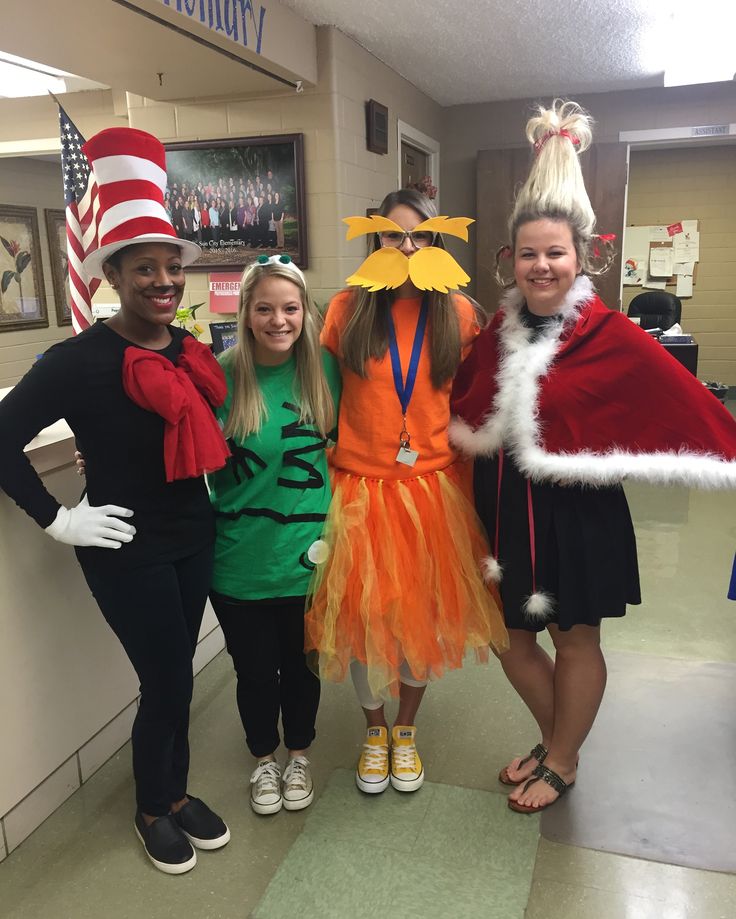 three girls and one boy are dressed up as dr seusster and cat in the hat