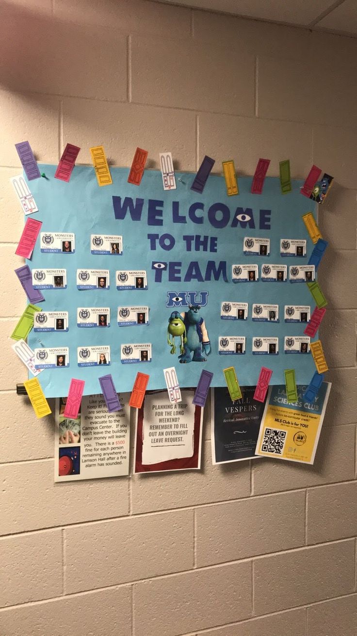 a bulletin board on the wall that says welcome to the team