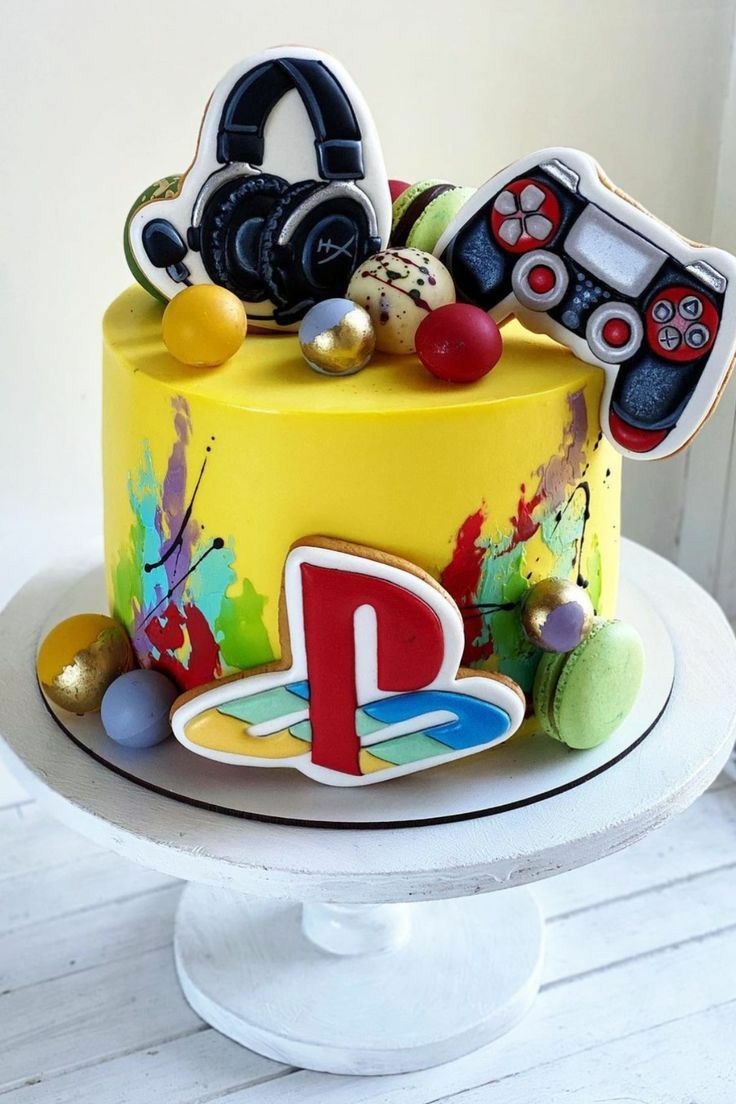 a decorated cake with video game controllers on it