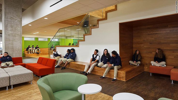 a group of people sitting on couches in a lobby