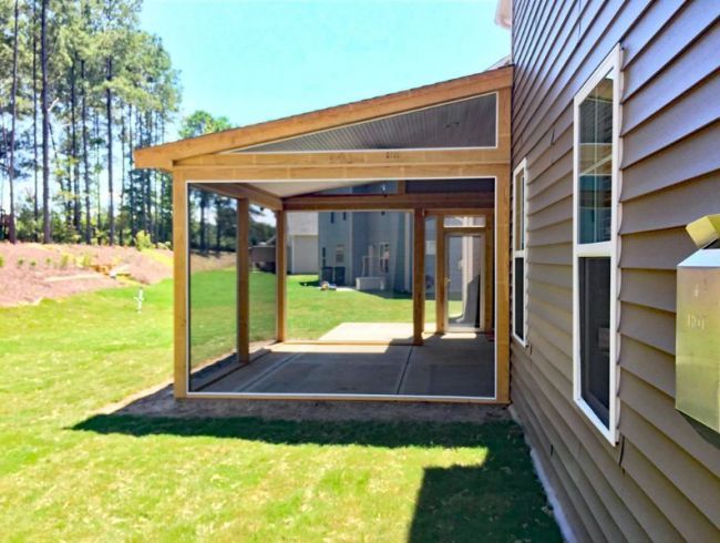 a house with a covered patio in front of it