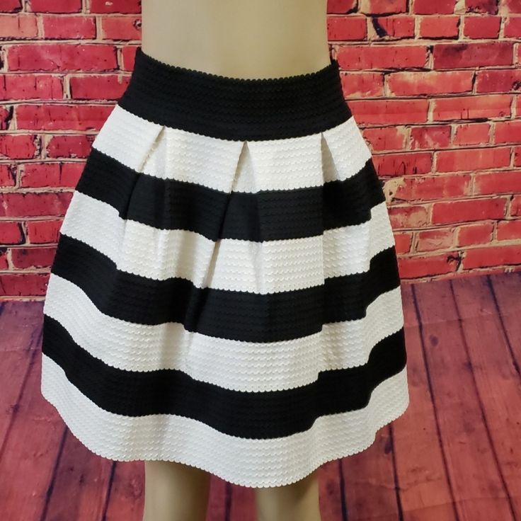 Piace Skirt Black And White Stripe Very Classy Well Made Size Large New With Tags Skirt Is Beautiful With A Formed Flare. Versatile With Boots, Leggings, Heels. Black And White Is Always In Style! Approximate Measurements Waist Flat - 14" With A Comfortable Stretch To 17" Bottom Flare Flat - 30" Length 18.5" 70% Polyester 30% Spandex Chic Striped Lined Skirt Bottoms, Chic Skirt With Striped Hem And Relaxed Fit, Chic Relaxed Skirt With Striped Hem, Chic Spring Skirt With Striped Hem, Chic Striped Hem Skirt For Summer, Chic Summer Skirt With Striped Hem, Spring Striped Flared Skirt, Chic Fitted Skirt With Striped Hem, Chic Vertical Stripes Midi Skirt