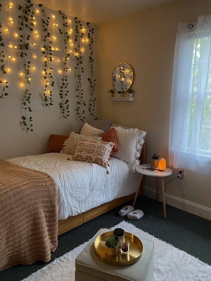 a bedroom with lights on the wall and a bed in front of a window that has white fluffy rugs