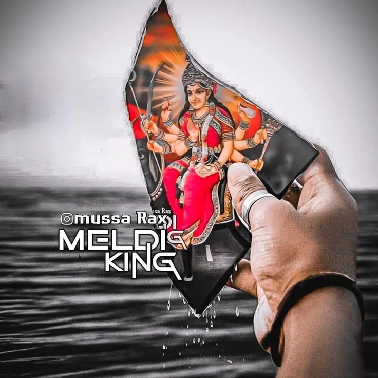 a hand holding up a kite with an image of two women on it and the words muda rama meldike king