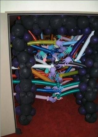 a bunch of balloons that are in the middle of a room