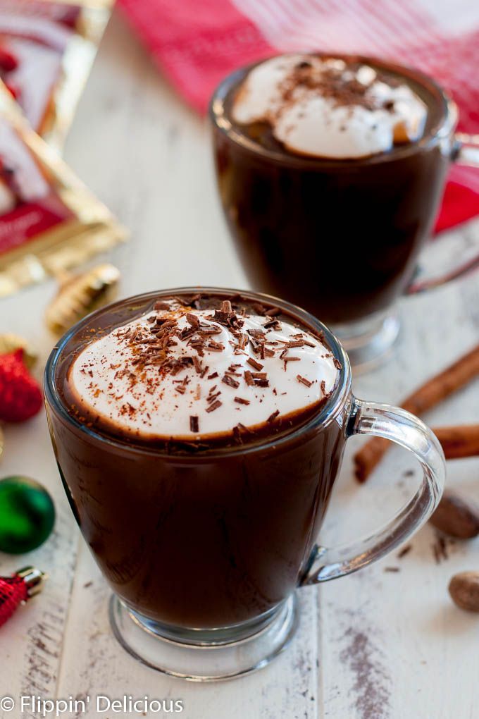 two glasses of hot chocolate on a table