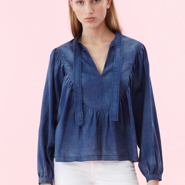 Discover The Most Feminine Way To Wear Denim With This Flowy Top. Its Gauzy, Tissue-Light Cotton Was Developed By A Renowned Mill With An Indigo Wash To Achieve Beautiful Tonal Variations. Thoughtful Details, Including Voluminous Sleeves And A Tie Neckline, Offer An Elevated Take On The Everyday Top. Model Is A Size Small. Height 5'10 Hits At Low Hip 24 1/2" Inches From High Point Shoulder 100% Cotton Hand Wash Cold, Do Not Bleach, Lay Flat To Dry, Low Iron If Needed Pullover Style Casual Medium Wash Blouse, Chic Washed Cotton Denim Top, Chambray Denim Top For Fall, Casual Washed Denim Blouse, Chic Dark Wash Cotton Tops, Summer Denim Blouse In Dark Wash, Summer Dark Wash Denim Blouse, Chic Relaxed Fit Light Wash Denim Top, Relaxed Fit Denim Tops For Daywear