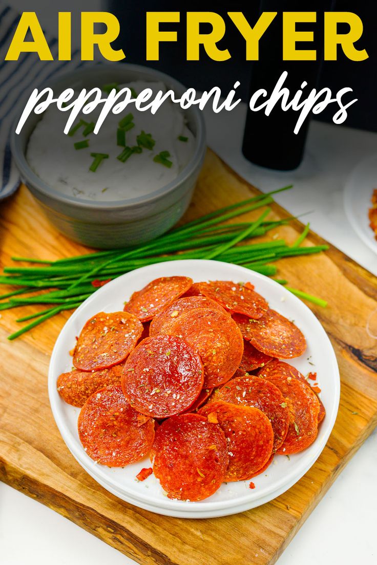 a white plate topped with pepperoni slices on top of a wooden cutting board next to green onions