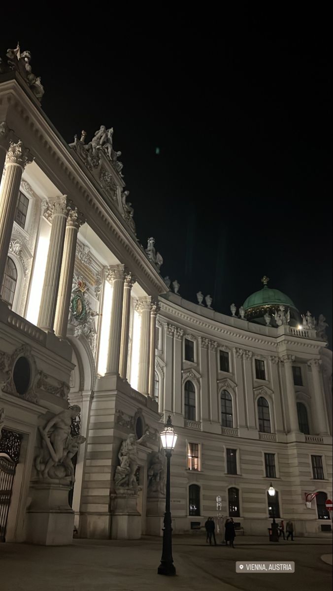 an ornate building lit up at night