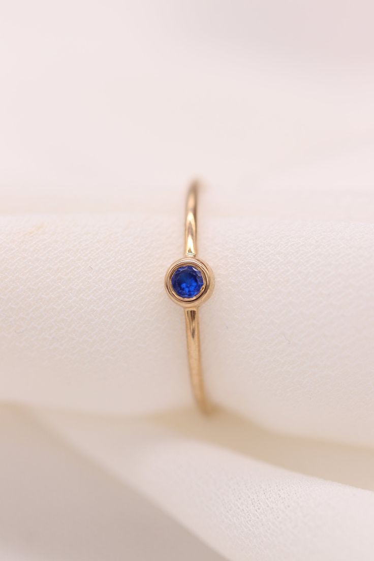 "Gold Sapphire Ring / Handmade Sapphire Ring / 14k & 18k Gold Minimalist Ring Available in Gold, Rose Gold, White Gold ❥ ITEM DETAILS ---> Gold Color of Choice : Yellow Gold, Rose Gold, White Gold ---> Material : 14k ( 585 ) or 18k ( 750 ) Real Gold. It is Not Gold Filled or Gold Plated ---> Made to order ---> Band Thickness : 1.20 mm ---> Band Width : 1.15 mm ---> Natural Sapphire ---> Sapphire Cut: Round ---> Number of Sapphire : 1 ---> Total Carat : 0.05ct ---&g Minimalist Sapphire Ring With Bezel Setting For Everyday, Minimalist Sapphire Ring With Bezel Setting As Gift, Everyday Delicate 14k Gold Birthstone Ring, Everyday Tiny 14k Gold Birthstone Ring, Minimalist Everyday Sapphire Ring, Dainty Sapphire Ring With Bezel Setting, Minimalist Yellow Gold Sapphire Ring With Bezel Setting, Minimalist Sapphire Ring With Single Diamond For Gift, Minimalist Sapphire Ring With Single Diamond As A Gift