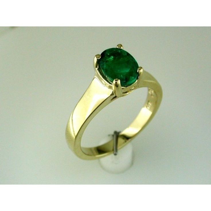 Radiant 14K Yellow Gold Emerald Ring - 0.95 Carat Oval Gemstone Classic Oval Cabochon Emerald Ring, Elegant Green Emerald Ring With Tension Setting, Classic Oval Emerald Ring With Tension Setting, Modern Oval Brilliant Cut Emerald Ring, Green Emerald Oval Cabochon Ring For Wedding, Green Oval Cabochon Emerald Ring For Wedding, Formal Oval Cabochon Emerald Ring For May, Elegant Oval Emerald Ring With Tension Setting, Classic Oval Tsavorite Emerald Ring