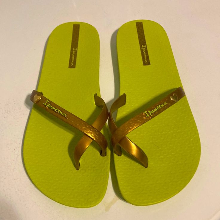 Ladies Sandals. Size 8/9. New, Never Worn, No Tags. Very Comfy, Flexible. Copperish Color Band With Lime Green Soles. Gold Flat Casual Flip Flops, Green Slip-on Summer Flip Flops, Casual Gold Flip Flops For Beach Season, Casual Gold Flip Flops For Beach, Green Flat Summer Flip Flops, Gold Flip Flops For Beach In Spring, Gold Jelly Sandals For Summer Beach, Gold Summer Sandals For Beach, Gold Jelly Sandals For Beach