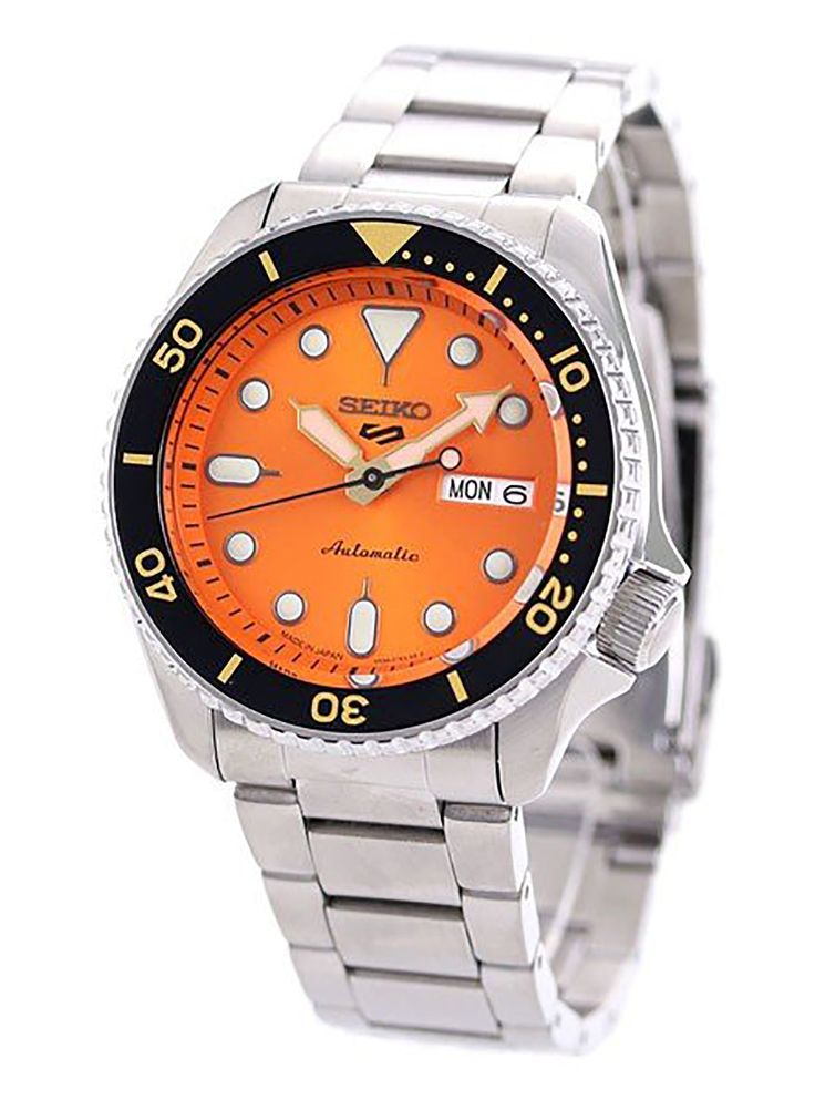 Seiko 5 Sports SBSA009 - men's watch produced by Seiko. It has Japanese automatic movement and 4R36 calibre. Stainless steel case of round shape. Case dimensions are 42.5 mm. in diameter and 13.4 mm. in thickness. The dial of this Seiko watch is orange. Display type: analog. This timepiece has hardlex glass. Stainless steel band, band color: silver. 100 m. water resistance. The watch is from 5 Sports collection. The following features are equipped: glowing hands, glowing markers, date, day, anti Sports Watches With Subdials And Round Dial, Automatic Chronograph Sports Watch With Round Dial, Sports Automatic Watches With Round Dial, Automatic Sports Watches, Classic Sports Watch With Round Dial, Sports Automatic Watches, Orange Display, Glowing Hands, Japanese Domestic Market