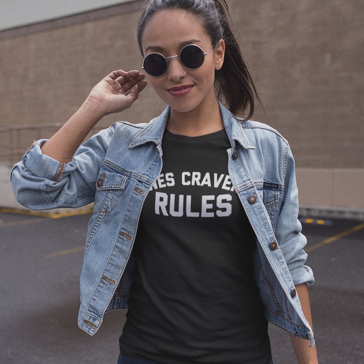 a woman wearing sunglasses and a t - shirt that says music is my therapy