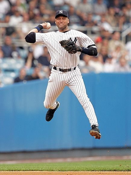 a baseball player is in mid air after throwing the ball