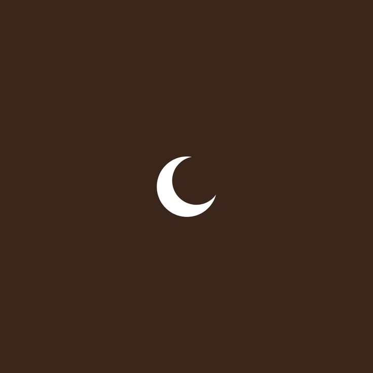 the moon is seen in this dark brown background