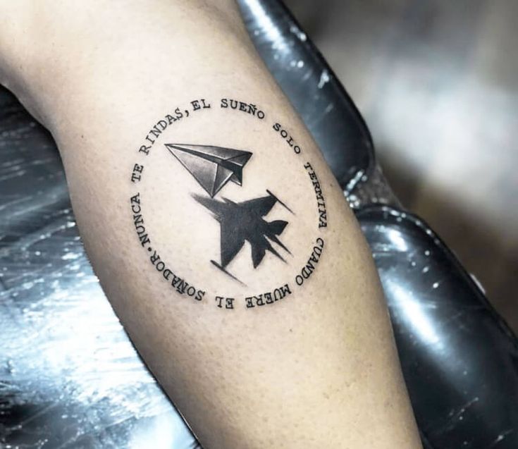 a person with a tattoo on their arm that says, the world is sure so you can fly