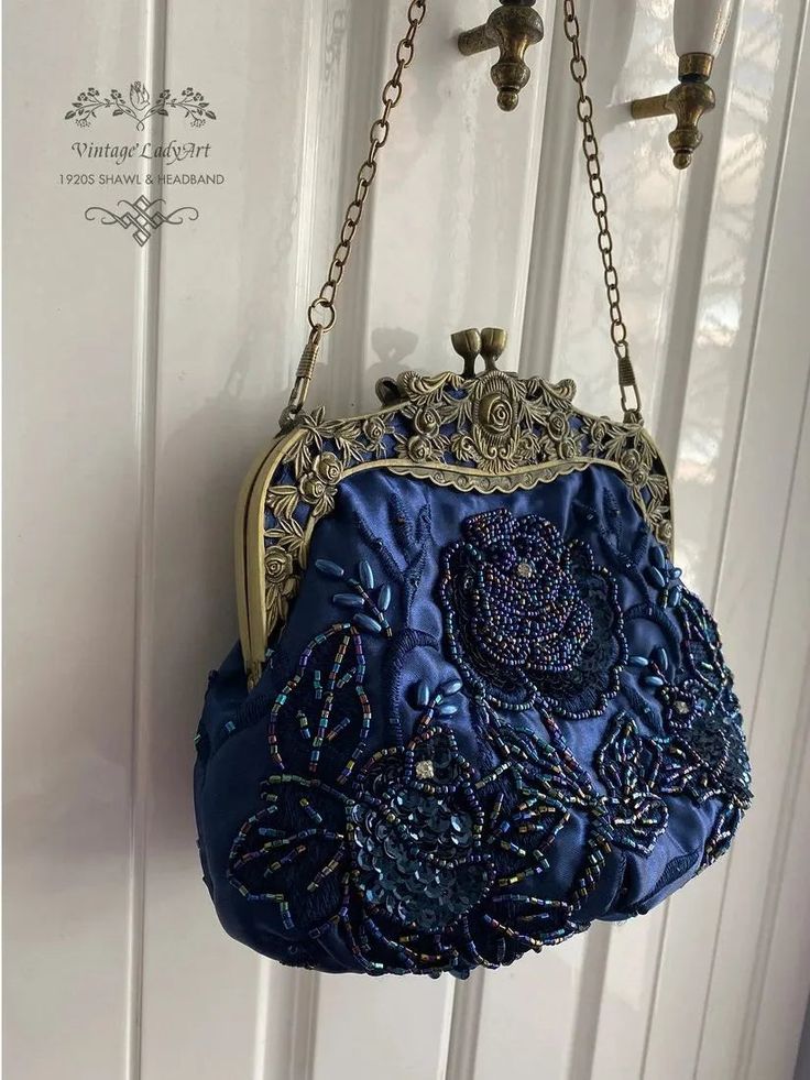 Treat yourself to a luxuriously elegant time-traveling experience with this Victorian-Vintage-inspired Embroidered Vintage Ladyart Handbag Purse. Crafted with exquisite attention to detail, this purse is beaded with delicate flower embroidery, expertly designed to transport you back to a forgotten era of sophistication and grace. Carry it as a subtle reminder of the exquisite beauty of a bygone era. Features two delicate chain straps (long and short) Size: 21cm/8.25" x 8.5cm/3.5" x 17cm/6.75" Gatsby Accessories, Handbag Ideas, Wedding Evening Party, 1920s Outfits, Weekend Wedding, Pearl Clutch, Evening Style, Navy Bag, Bridal Handbags