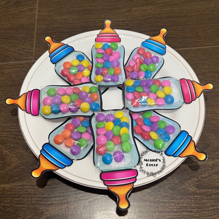 there is a plate that has candy in the shape of a cross on top of it