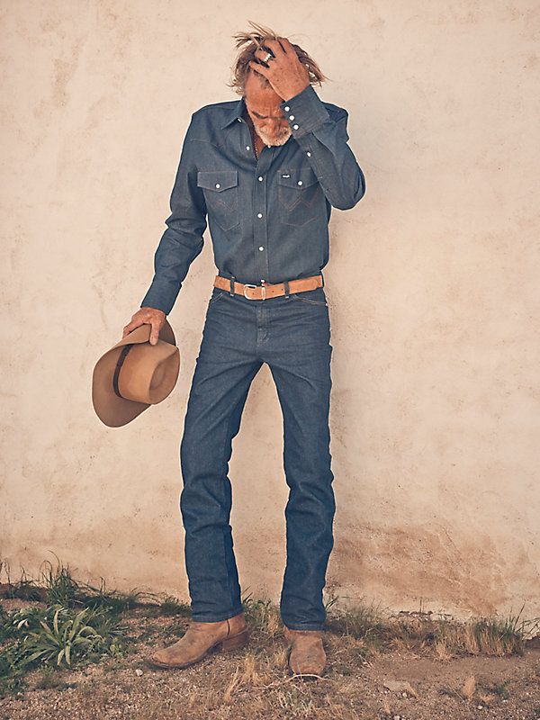 FINALLY, JEANS THAT FIT LIKE A GLOVE Wrangler® Cowboy Cut® jeans are a tried-and-true wardrobe staple for cowboys who demand a lot from their everyday clothes. Our men's Cowboy Cut® 0936 comes with all the same iconic details of the 13MWZ, including the classic neolite patch, five-pocket styling, and that signature 'W' stitching you know and trust. What makes the 0936 jean a must-have for every modern cowboy is its slim silhouette through the seat, thigh, and knee. Whether dressed up for a speci Western Style Dark Wash Jeans For Fall, Western Dark Wash Jeans For Fall, Western Style Dark Wash Fall Jeans, Fitted Dark Wash Western Jeans, Fitted Western Style Dark Wash Jeans, Fitted Denim Blue Western Bottoms, Fitted Western Dark Wash Jeans, Fitted Western Style Denim Blue Bottoms, Western Style Fitted Jeans For Rodeo