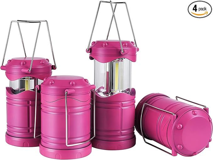 three pink lanterns are sitting next to each other with one light on it's side