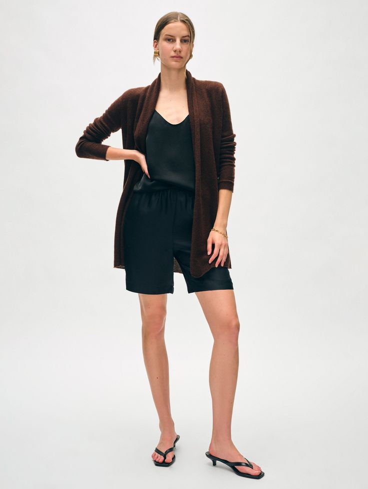 The longest-running piece at White + Warren, the Cashmere Trapeze Cardigan is a chic fingertip-length open sweater that works on every body type. No matter what color you choose, you'll want to wear this timeless style season after season. Details Straight fit. Long sleeve. Length in size small is 32 1/2". The model is 5'11 1/2" and is wearing a size small. 100% Cashmere. Hand wash cold or dry clean. Do not twist or wring. Reshape and lay flat to dry. Warm iron if needed. Style #11092 Cashmere Travel Wrap, Travel Tops, Open Sweater, Cardigan Top, Wrap Sweater, Sweater Sale, Knitwear Cardigan, Fall Shopping, No Matter What