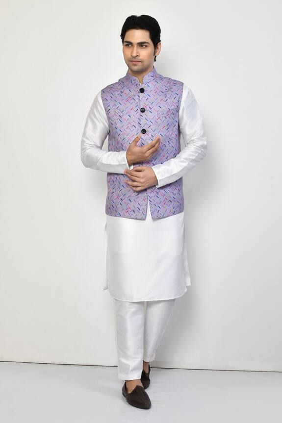 Purple sleeveless bundi with all over herringbone pattern. Paired with a white full sleeves plain kurta and a pant. - Aza Fashions White Fitted Nehru Jacket For Spring, White Nehru Jacket With Stand Collar For Festive Occasions, White Festive Nehru Jacket With Stand Collar, Festive White Nehru Jacket With Stand Collar, White Fitted Kurta With Stand Collar, White Fitted Nehru Jacket For Transitional Season, White Winter Festive Kurta, White Sleeveless Cotton Kurta, Sleeveless White Kurta For Spring