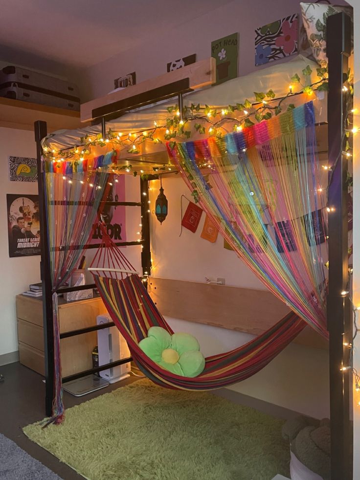 a room with a bed and a hammock hanging from the ceiling