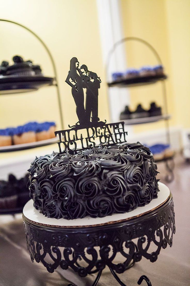 there is a cake on the table that says happy birthday and it has a silhouette of two people