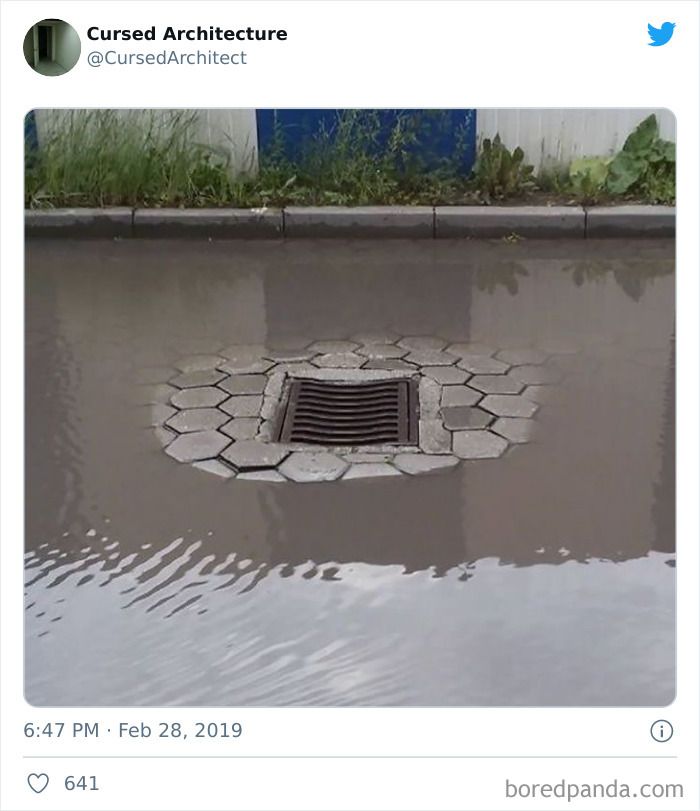 a manhole cover in the middle of a puddle