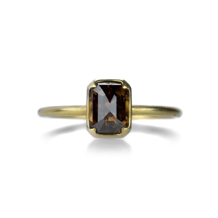 Gabriella Kiss Emerald Cut Brown Diamond Ring | Quadrum Gallery Engagement Rings Brown Diamond, Brown Diamond Ring Engagement, Brown Engagement Ring, Champagne Engagement Ring, Champagne Engagement Rings, Chocolate Diamond Ring Engagement, Brown Engagement Rings, Brown Diamond Engagement Ring, Chocolate Diamond Ring