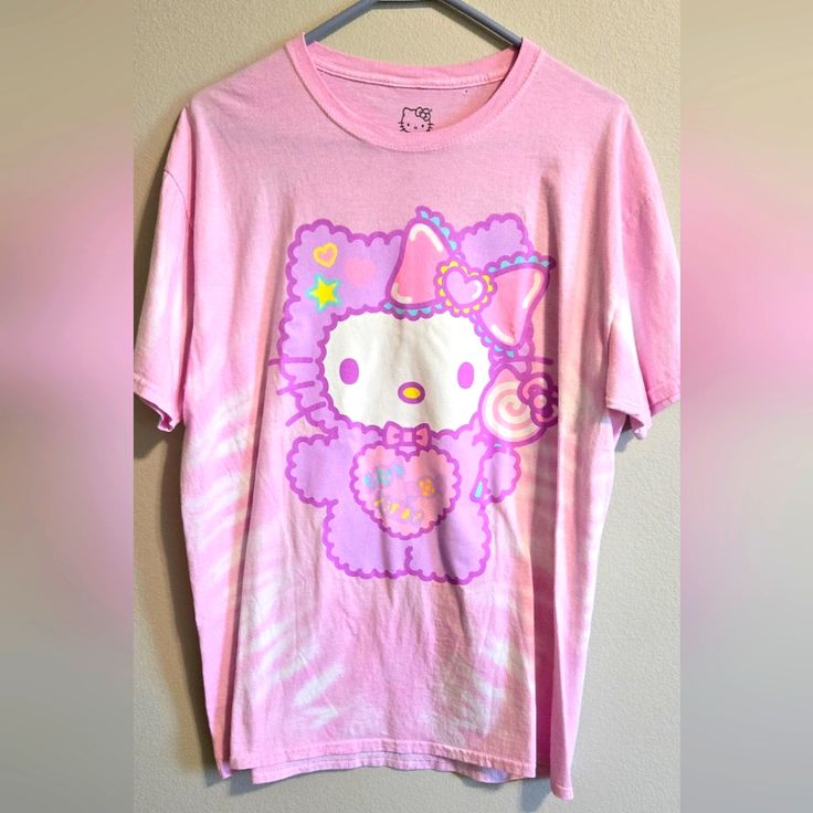 Sanrio Hello Kitty Tshirt Size L Never Worn By Me But Has A Small Hole By Collar As Pictured Casual Pink Hello Kitty T-shirt, Pink Cotton Hello Kitty T-shirt, Trendy Pink Hello Kitty T-shirt, Pink Hello Kitty T-shirt For Spring, Cute Pink Hello Kitty T-shirt, Hello Kitty Kawaii T-shirt For Spring, Kawaii Hello Kitty T-shirt For Spring, Kawaii Hello Kitty Cotton T-shirt, Cute Hello Kitty Cotton T-shirt