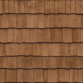 a close up view of a brown roof with wood shingles on it's sides