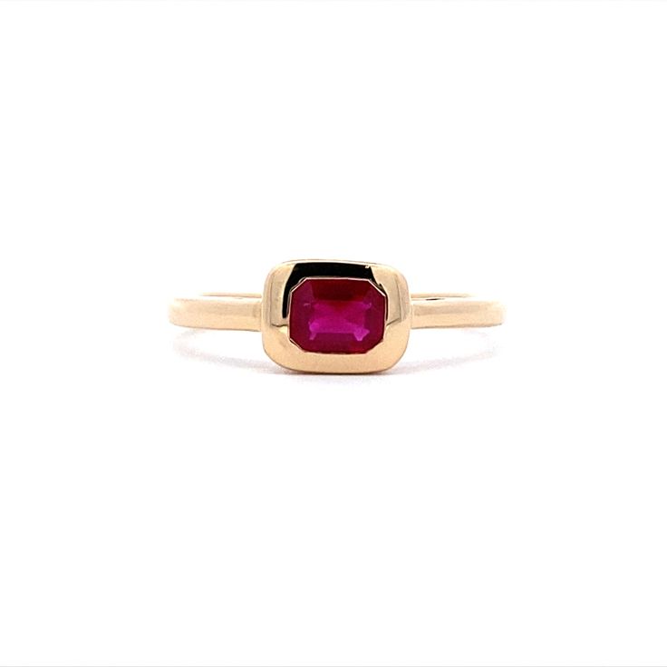 A vibrant red ruby is set with east-west orientation for a contemporary take on a classic style in this gemstone solitiare ring. The Ruby weighs 0.65 carats and is set in a gleam bezel of 14K Yellow Gold. This ring is in-stock in 6.5 finger size. Most ring styles can be sized up to 2 sizes up or down. Additional ring sizes can be made to order. Contact us for availability of orders in other finger sizes. To keep your ring as beautiful as it is right now, please stop by our store at least every s Pink Stone Rings, 5 Fingers, Ring Styles, Please Stop, Ring Sizes, Red Ruby, East West, Ruby Ring, Pink Stone