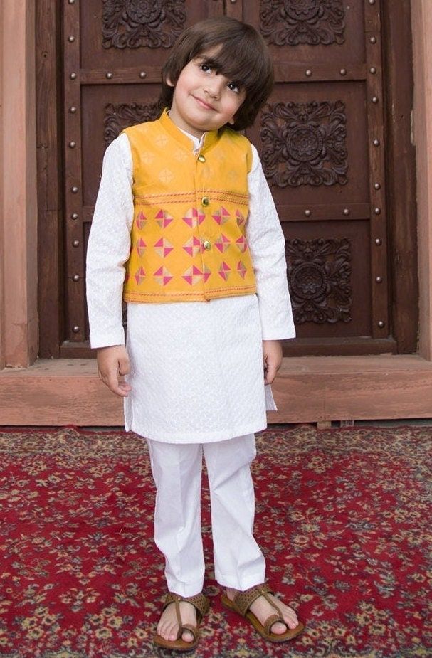 3 Piece - Kurta Shalwar and waistcoat :Let your little one stand out from the crowd in this kurta with waistcoat paired with trouser to complete the look. Details : Shirt :White ChickenKari kurta (shirt) . Waist Coat : Screen printed Waistcoat Trouser: Straight Cotton Lawn trouser. Country of Origin : Pakistan Care Instruction : Should be washed in gentle cycle and hung to dry. Color may bleed so please be mindful of other items with it. Disclaimer : Actual sizes might be slightly different from Kurta With Waistcoat, 3 Piece Dress, Chicken Kari, Kurta Shirt, Boys Kurta, Waist Coat, White Chicken, Piece Dress, Shirt White