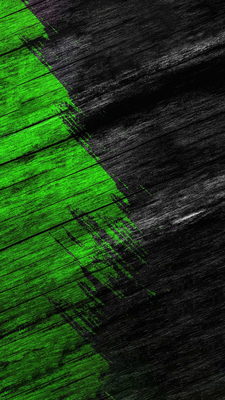 an abstract green and black painting on wooden planks with paint streaks in the background