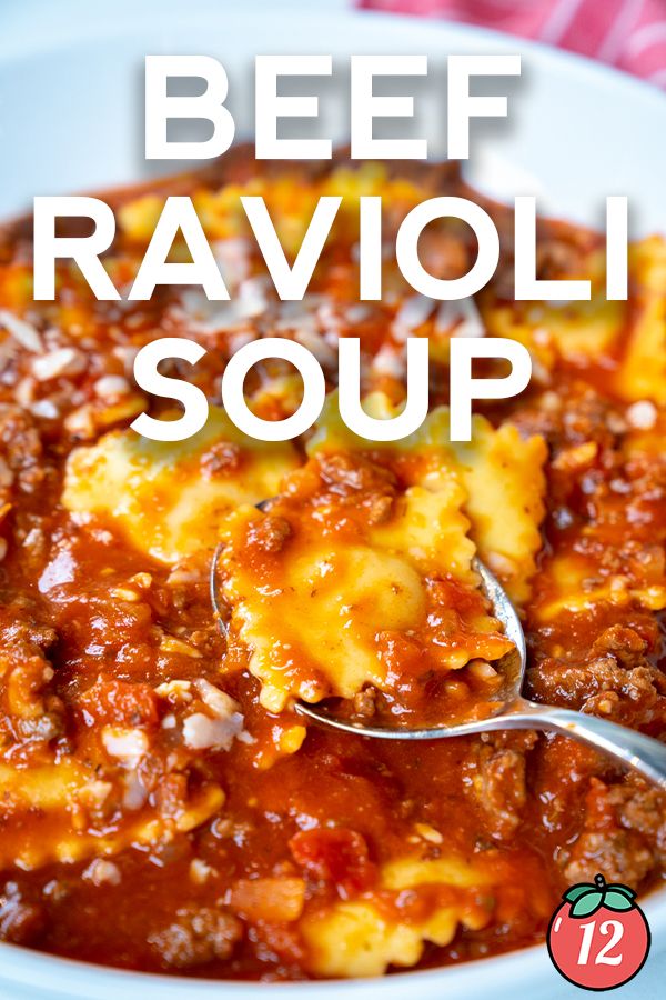 beef ravioli soup in a white bowl with a spoon on the side and text overlay that reads beef ravioli soup