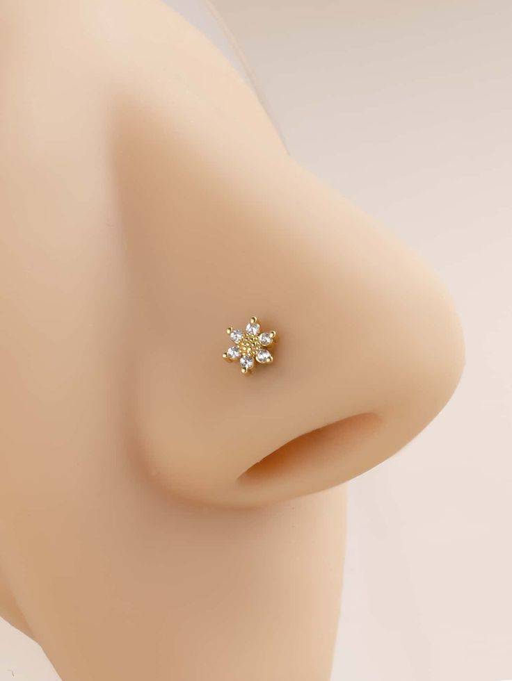 a close up view of the back of a mannequin's head with an earring