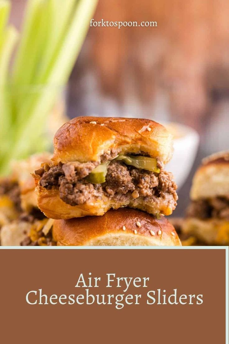 two hamburger sliders stacked on top of each other with the words air fryer cheeseburgers