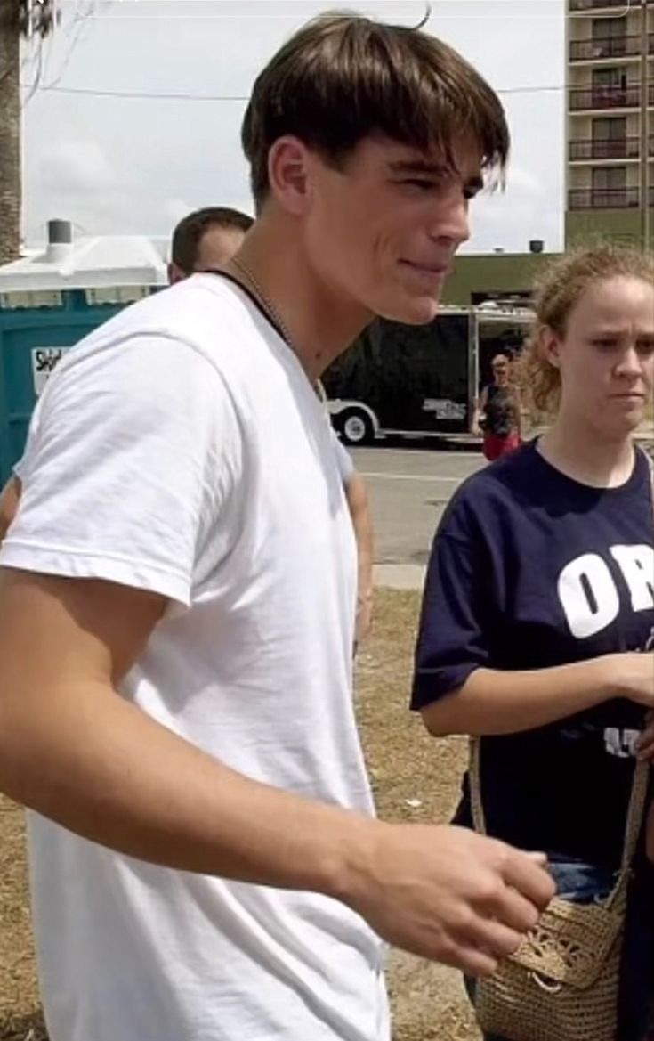 two young people standing next to each other