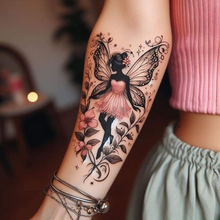 a woman's arm with a tattoo on it that has a flower and a fairy