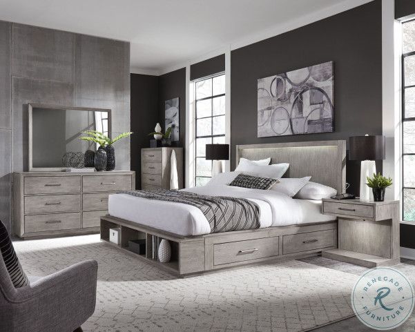 a bedroom with gray walls and furniture in it