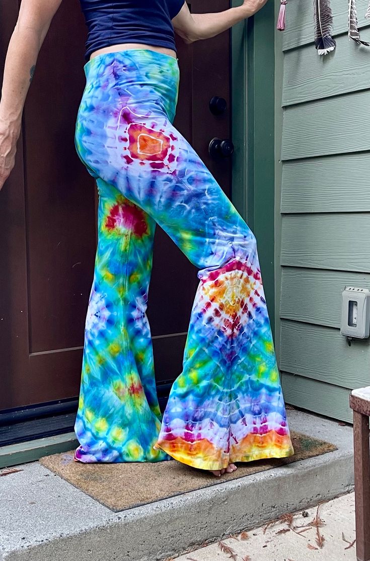 Stunning & unique bell bottom Pants  Hand tied & ice dyed in vibrant rainbow colors  Handmade in US Super flattering, comfortable & hold their shape with wear Size XL waist: 33-34.5" Hips: 35-36" Thighs: 23-24" Inseam 32" Casual Multicolor Flare Bottoms, Multicolor Flare Cotton Bottoms, Multicolor Cotton Flare Bottoms, Multicolor Stretch Flare Pants, Groovy Flare Bottoms For Summer, Multicolor Flare Summer Pants, Groovy Flared Bottoms For Summer, Multicolor Flare Pants For Summer, Fitted Hippie Flares For Summer